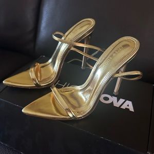 Brand new gold lace up heels in size 5.5. Only worn once for 2 hours.